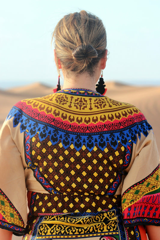 woman in brown and black tribal print shirt