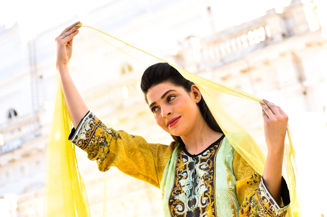 woman in yellow and blue floral long sleeve dress