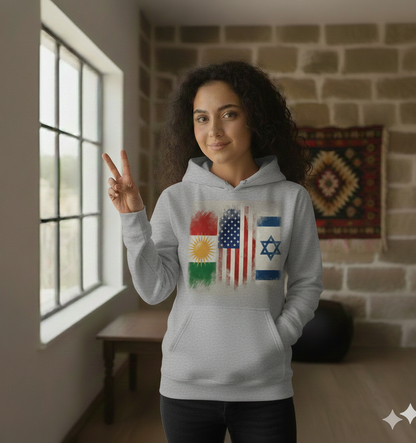 A female model wearing a grey hoodie that showcases the flags of kurdistan, israel and usa.