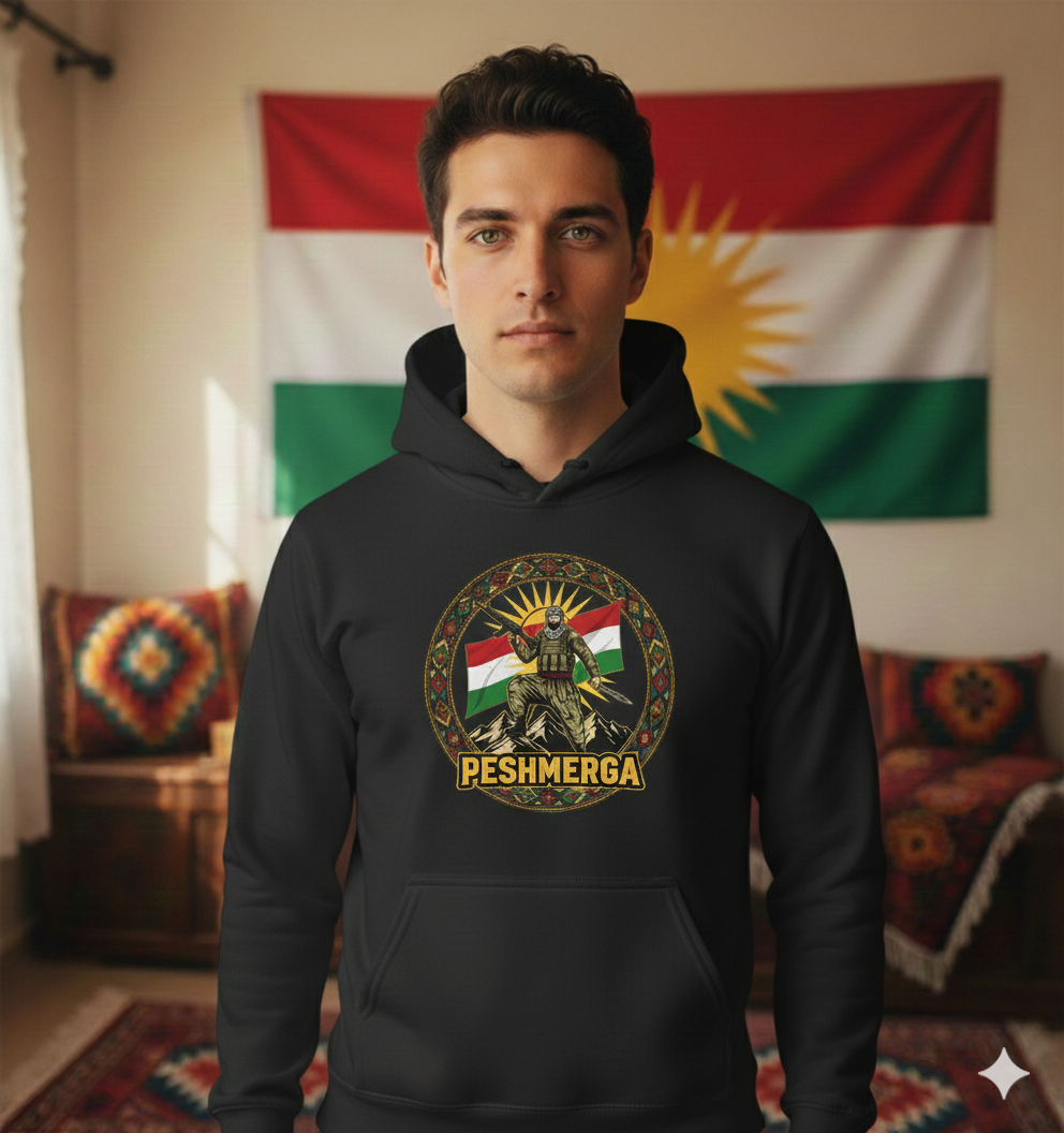 A Kurdish male model wearing a black hoodie displaying a Kurdish peshmerga design. 