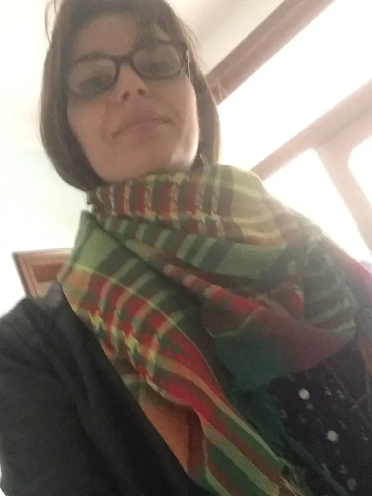 A female wearing the YPG scarf for show