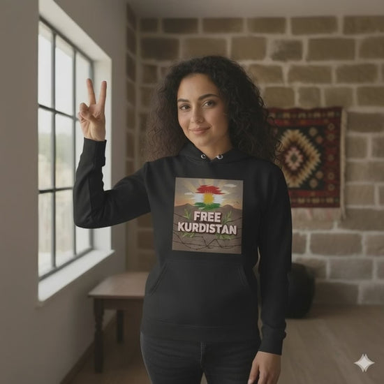 A female model wearing a black hoodie which says free Kurdistan. 