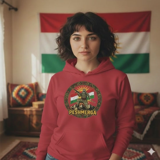 A Kurdish female model a red hoodie which displays a peshmerga design. 