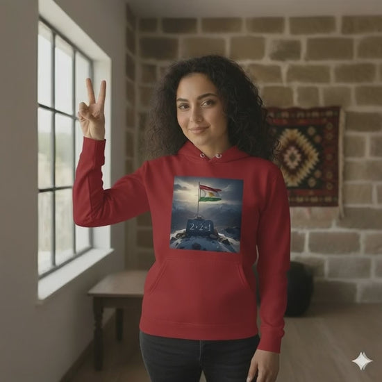 A video of a female model wearing a red hoodie that says 2 + 2 = 1 which is a Kurdish saying. 